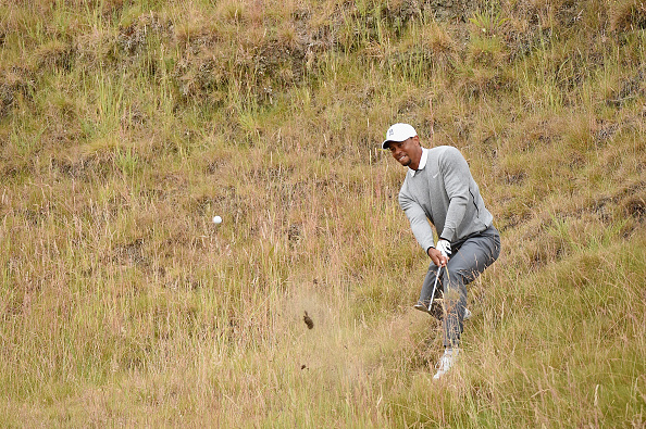 UNIVERSITY PLACE, WA - JUNE 19:  Tiger Woods of the United States plays a shot in the rough near the tenth green during the second round of the 115th U.S. Open Championship at Chambers Bay on June 19, 2015 in University Place, Washington.  (Photo by Harry How/Getty Images)
