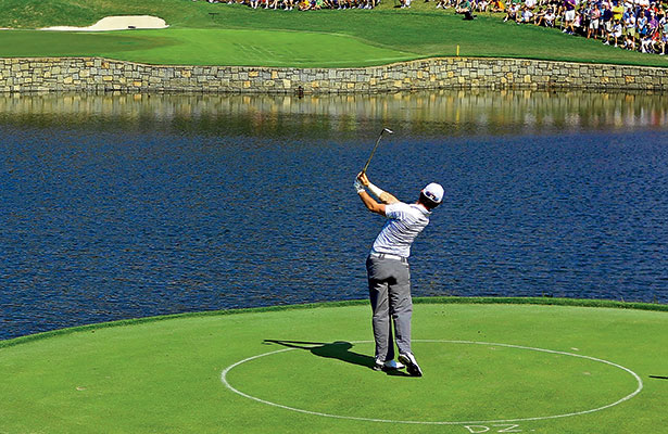 Rory McIlroy hits one from the drop zone at Atlanta Athletic Club