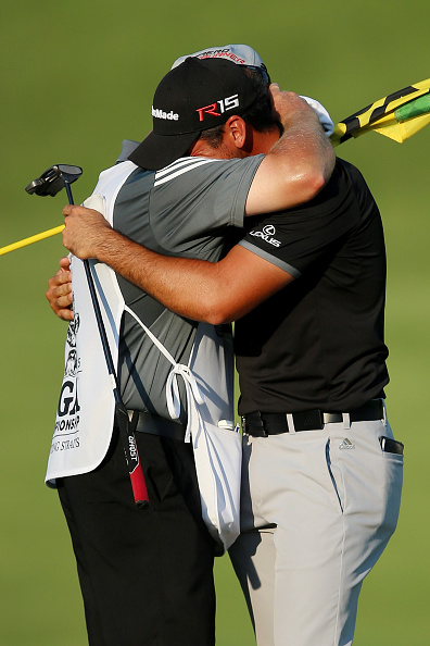 SHEBOYGAN, WI - AUGUST 16:  Jason Day of Australia celebrates with his caddie Colin Swatton on the 18th green after winning the 2015 PGA Championship with a score of 20-under par at Whistling Straits on August 16, 2015 in Sheboygan, Wisconsin.  (Photo by Andrew Redington/Getty Images)